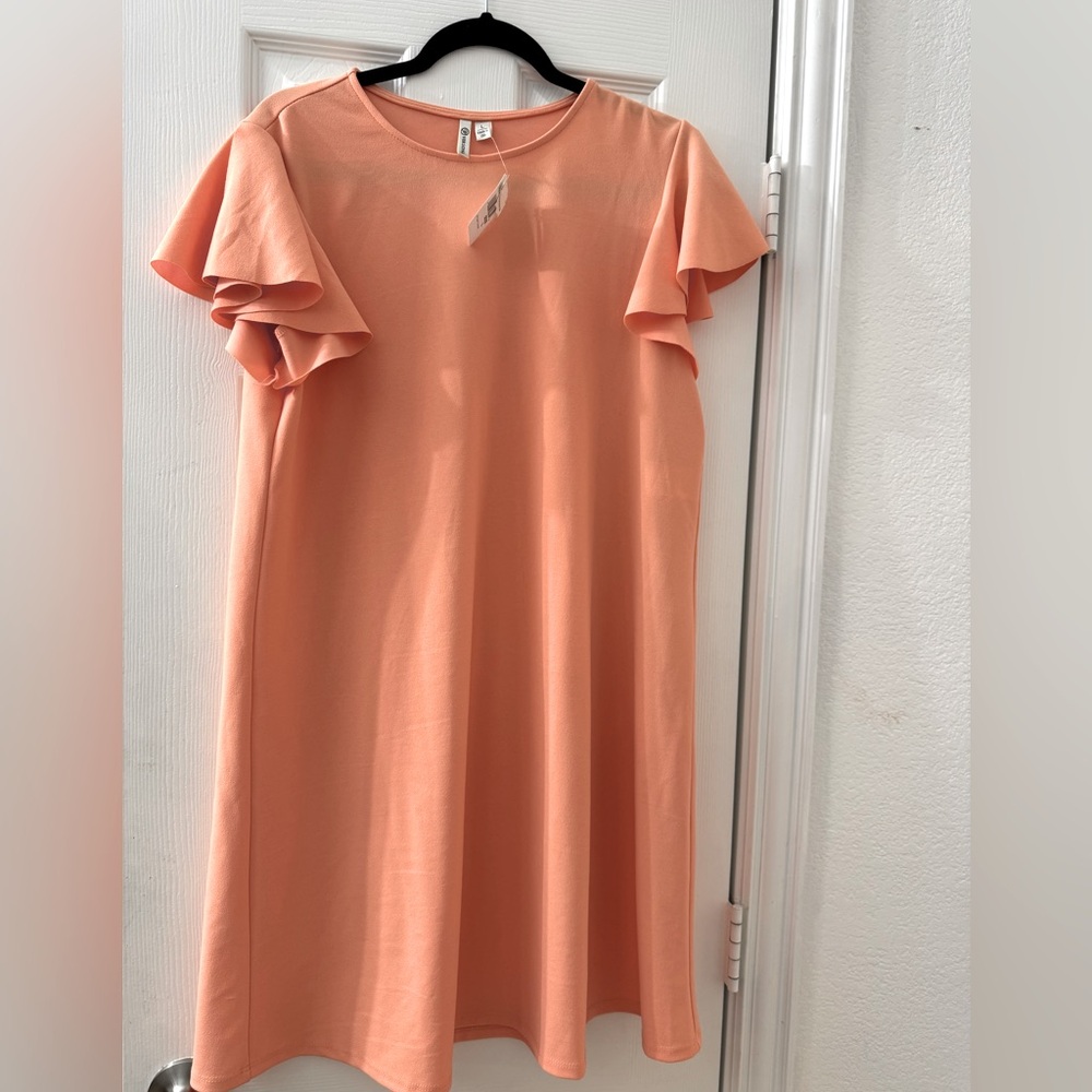 Peach color dress with ruffles